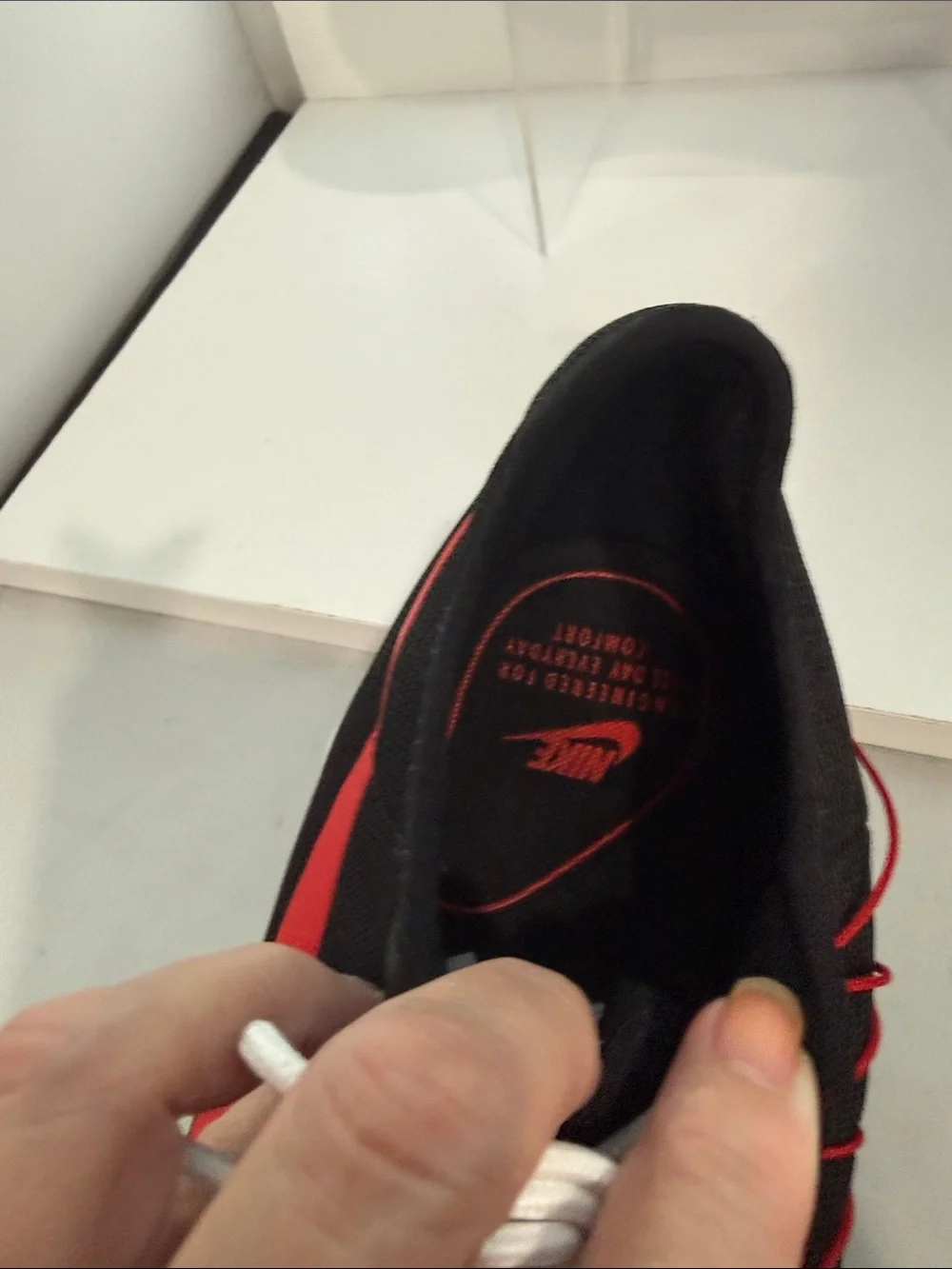 Nike Men's Black Athletic Shoes with Red Swoosh and White Sole